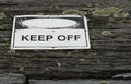 Keep off warning sign over old weathered rustic wooden textured Royalty Free Stock Photo