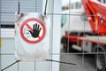 `Keep out` warning sign at fence protecting construction site with blurry background Royalty Free Stock Photo