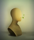 Keep quiet no words concept, realistic vintage mannequin with plant pierce from the inside,