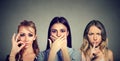 Keep a secret be quiet concept. Three secretive young women keeping mouth shut. Royalty Free Stock Photo