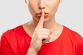 Keep secret silence gesture close up woman Royalty Free Stock Photo