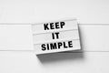 Keep it simple text on lightbox sign Royalty Free Stock Photo