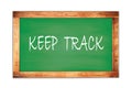 KEEP TRACK text written on green school board