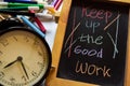 Keep up the good work on phrase colorful handwritten on chalkboard, alarm clock with motivation and education concepts Royalty Free Stock Photo