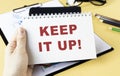 KEEP IT UP text concept write on notebook.