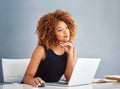 Keep your eye on the prize. a young businesswoman working on her laptop.