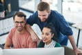 Keep your eyes on trends then capitalise on them. a group of young businesspeople using a computer together in a modern Royalty Free Stock Photo