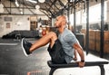 Keep your legs in a tabletop position. a young man completing crunches on a bench. Royalty Free Stock Photo