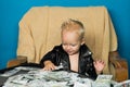 Keeping business on top. Boy child with money case. Little boy count money in cash. Small child do business accounting