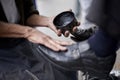 Keeping the businessmens shoes shiney. a shoe shiner shining a businessmans shoes. Royalty Free Stock Photo