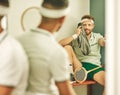 Keeping it chill after a hot game. two young men chatting in the locker room after a game of squash.