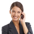 Keeping the connection going. Studio shot of a young businesswoman talking on her mobile phone isolated on white. Royalty Free Stock Photo