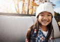 Keeping cool in the crisp days of autumn. Portrait of an adorable little girl enjoying an autumn day outdoors. Royalty Free Stock Photo