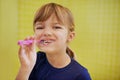 Keeping decay away. Portrait of a cute little girl brushing her teeth. Royalty Free Stock Photo