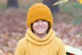 Keeping head warm in fall. Happy child wear knitted hat on autumn day. Small kid enjoy fall style. Little girl smile in Royalty Free Stock Photo