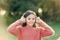 Keeping her connected to her entertainment. Adorable little girl outdoor. All she wants to hear is music. Little girl Royalty Free Stock Photo