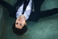 Keeping his head above water. Portrait of a young businessman wearing a suit while floating in a pool. Royalty Free Stock Photo