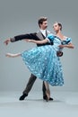 Contemporary ballroom dancers on grey studio background