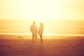 Keeping the romance alive. Rearview shot of an affectionate mature couple walking hand in hand on the beach. Royalty Free Stock Photo