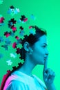 Creative collage. Side view portrait of young girl isolated over green background. Female head consist of puzzle pieces