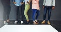 Keeping your message firmly on the ground. Cropped studio shot of a group of people standing behind blank paper against Royalty Free Stock Photo