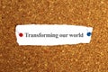 transforming our world word on paper