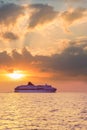 Commercial ferry passing Kefalonia island at sunset Royalty Free Stock Photo