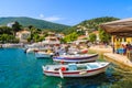 KIONI PORT, ITHACA ISLAND - SEP 19, 2014: colourful fishing boats in Kioni port. Greece is very popular holiday destination in