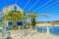 Traditional greek house with vine growing on terrace in Fiskardo village, Kefalonia island, Greece Royalty Free Stock Photo