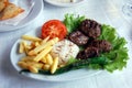 Kefte (lamb chops) with rice and French fries Royalty Free Stock Photo