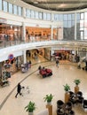 Wide large overhead view of Large german shopping center with DM, S and D outlet, Jeans road stores and customers