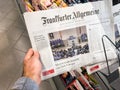 Male Hand Holding Frankfurter Allgemeine Newspaper