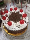 Blackforest cake with cherries and cream