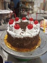 Blackforest cake with cherries and cream