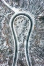 Kekesteto, Hungary - Aerial view of curvy road called the Horseshoe of Matra Matrai patko in snow covered forest