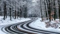 Kekesteto, Hungary - Winding winter road at the mountains of Matra near Kekesteto. Curved asphalt road with snowy trees