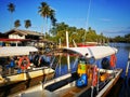 Kelantan, Malaysia -fishing boat near wooden jetty. Beautiful malaysian landscape. Sunset reflection in the water. Royalty Free Stock Photo