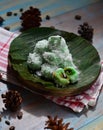 kelepon or klepon made from glutinous rice flour and filled with brownn sugar covered with grated coconut. indonesian food.