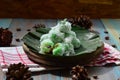 kelepon or klepon made from glutinous rice flour and filled with brownn sugar covered with grated coconut. indonesian food