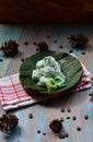 kelepon or klepon made from glutinous rice flour and filled with brownn sugar covered with grated coconut. indonesian food