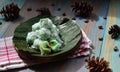 kelepon or klepon made from glutinous rice flour and filled with brownn sugar covered with grated coconut. indonesian food