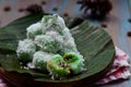 kelepon or klepon made from glutinous rice flour and filled with brownn sugar covered with grated coconut. indonesian food