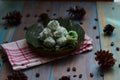 kelepon or klepon made from glutinous rice flour and filled with brownn sugar covered with grated coconut. indonesian food.