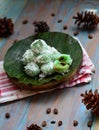 kelepon or klepon made from glutinous rice flour and filled with brownn sugar covered with grated coconut. indonesian food