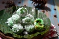 kelepon or klepon made from glutinous rice flour and filled with brownn sugar covered with grated coconut. indonesian food.