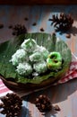 kelepon or klepon made from glutinous rice flour and filled with brownn sugar covered with grated coconut. indonesian food