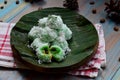 kelepon or klepon made from glutinous rice flour and filled with brownn sugar covered with grated coconut. indonesian food