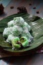 kelepon or klepon made from glutinous rice flour and filled with brownn sugar covered with grated coconut. indonesian food