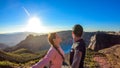 Kelimutu - A couple admiring the turquoise colored lake