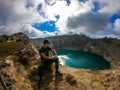 Kelimutu - A man admiring turquoise coloured volcanic lakes